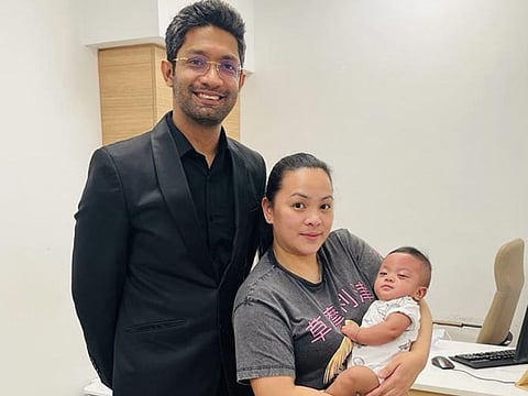 Dr Boopathy Murugavel (left), Ophthalmology Specialist at Aster Hospital, Al Qusais with Jenelyn Ognita, the mother, and the baby 