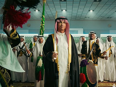 Al Nassr's Portuguese superstar Cristiano Ronaldo wears the traditional Saudi attire and holds a sword at his team's celebration of the kingdom's National Day last month. 