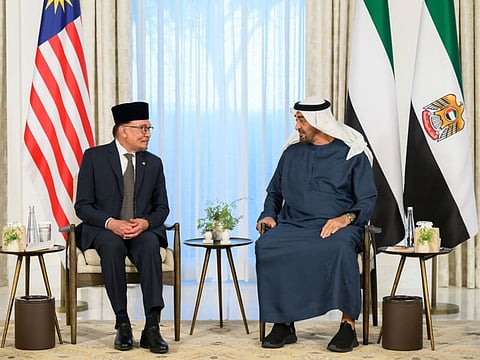 His Highness Sheikh Mohamed bin Zayed Al Nahyan, President of the United Arab Emirates (R) meets with Anwar Ibrahim, Prime Minister of Malaysia (L), at Al Shati Palace.