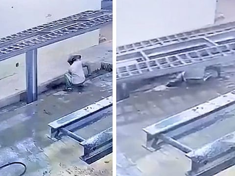 In the footage, taken from a surveillance camera, the worker is seen cleaning the floor of the workshop where the automatic crane used for lifting cars suddenly falls on him.