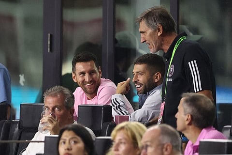 Lionel Messi and Jordi Alba of Inter Miami CF watch from the sidelines against the New York City in the second half at DRV PNK Stadium on September 30.