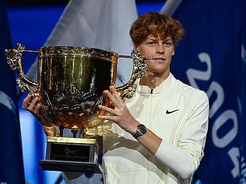 Italy's Jannik Sinner with the winning trophy after defeating Russias Daniil Medvedev in the men's singles final during the China Open in Beijing on Wednesday.