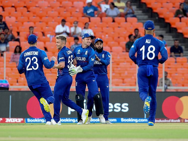 England's skipper Jos Buttler and Sam Curran