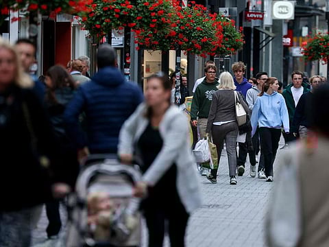 People walk in a street in Luxembourg on September 29, 2023 ahead of the upcoming Luxembourg's legislative elections