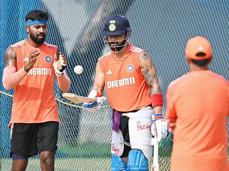 India's Virat Kohli (C) and Hardik Pandya attend a practice session