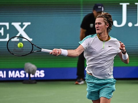 USA's Sebastian Korda powers a forehand return to Russia's Daniil Medvedev during their men's singles match at the Shanghai Masters on Sunday.