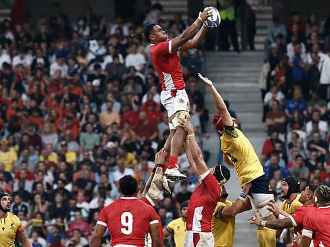 Tonga's flanker Semisi Paea grabs the ball in a line out during the Rugby World Cup Pool B match against Romania at the Stade Pierre-Mauroy in Villeneuve-d'Ascq, near Lille, on Sunday.