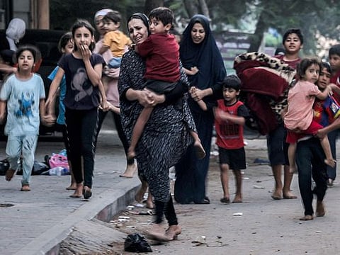 Photos: Palestinians in Gaza reel from heavy Israeli bombing