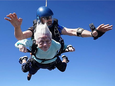 This photo provided by Daniel Wilsey shows Dorothy Hoffner, 104, falling through the air with tandem jumper Derek Baxter as she becomes the oldest person in the world to skydive, Sunday, Oct. 1, 2023, at Skydive Chicago in Ottawa, Ill. 