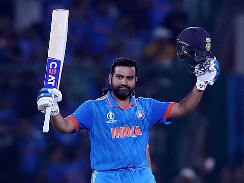 Indian skipper Rohit Sharma celebrates after reaching his century, seventh in the World Cup, against Afghanistan on Wednesday.