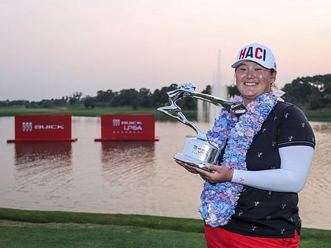 USA's Angel Yin celebrates with her trophy after winning the Shanghai LPGA golf tournament in Shanghai on Sunday.