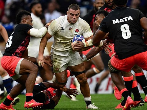 England's No 8 Ben Earl runs with the ball during the Rugby World Cup quarter-final match against Fiji at the Velodrome Stadium in Marseille, southeastern France, on Sunday.