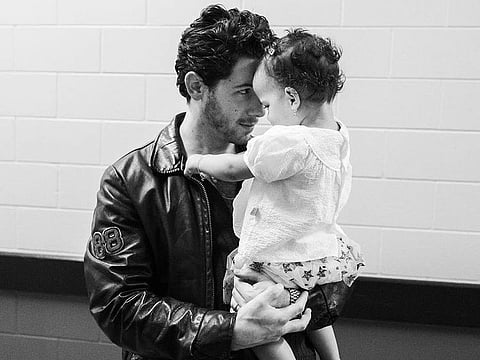 Nick Jonas and daughter and Malti 