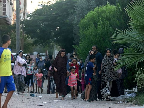 Palestinian families flee their homes following an Israeli attack on the Rafah refugee camp, in the southern of Gaza Strip on Octobers 15, 2023.  
