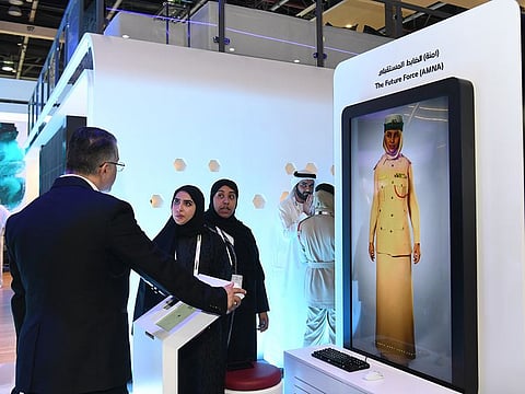 Amna on screen interacting with visitors at Gitex tech show in Dubai