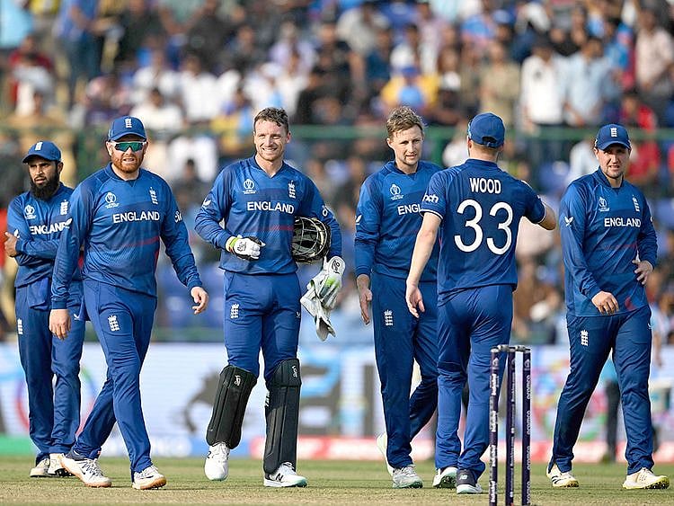 File photo: England's captain Jos Buttler (C) along with his teammate