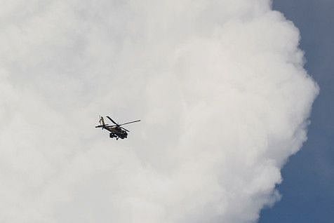 An Israeli Apache helicopter over Israel's border with Lebanon, in northern Israel, on October 18, 2023. 