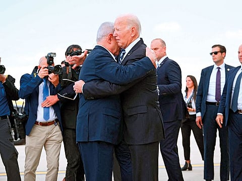 US President Joe Biden hugs Israel Prime Minister Benjamin Netanyahu upon his arrival at Tel Aviv’s Ben Gurion airport on Wednesday, amid the ongoing battles between Israel and the Hamas.