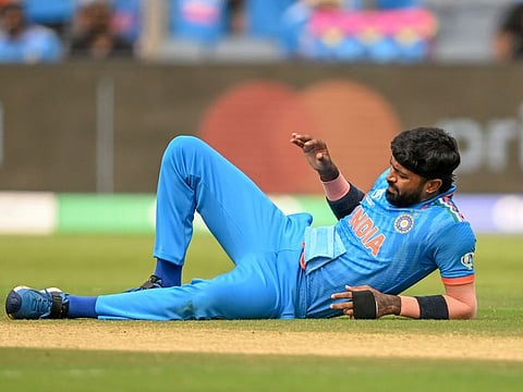 India’s Hardik Pandya falls to the ground after injuring his left ankle during their match against Bangladesh in Pune on October 19.