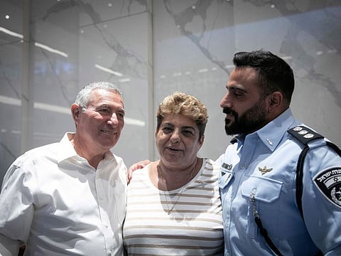 Rachel Edri poses for a portrait with Doron Almog, Jewish Agency Chairman, left, during a meeting with US President Joe Biden, in Tel Aviv, Israel, Wednesday, October 18.  