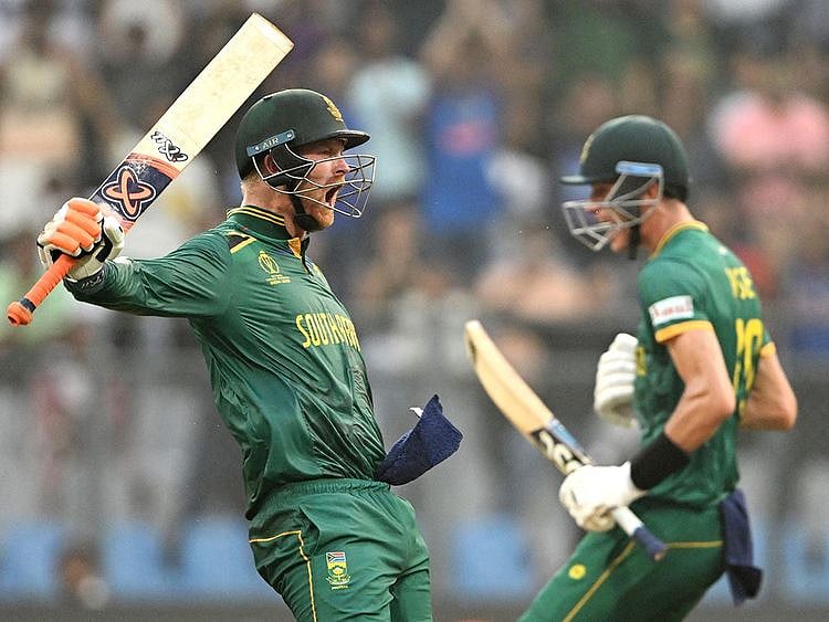 South Africa's Heinrich Klaasen (L) celebrates after scoring a century next to Marco Jansen 