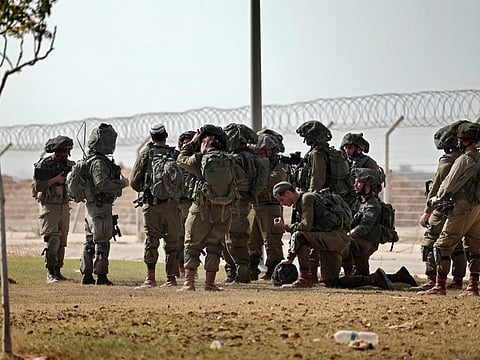 Israeli soldiers patrol along the border with the Gaza Strip, in the aftermath of a Palestinian militant attack on October 7.  