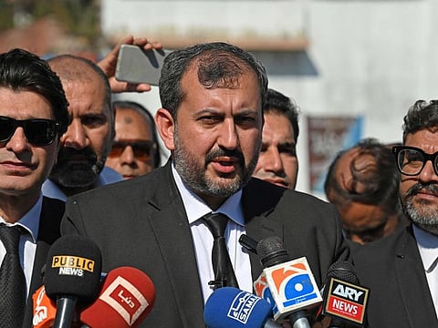 Umar Khan Niazi, the lawyer of jailed former Pakistan prime minister Imran Khan, speaks with media outside the Adiala Jail in Rawalpindi on October 23, 2023.  