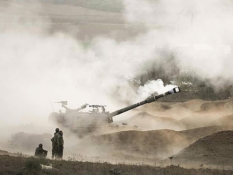 An Israeli mobile artillery unit fires a shell from southern Israel towards the Gaza Strip, in a position near the Israel-Gaza border, on Wednesday, October 25, 2023. 