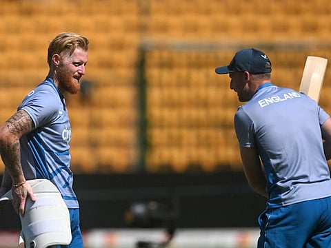 England's captain Jos Buttler (right) speaks with Ben Stokes during a practice session on the eve of their World Cup match against Sri Lanka.
