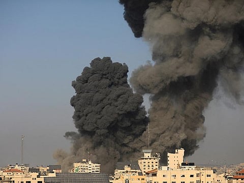 Smoke billows following an Israeli strike, in Gaza City, on October 25, 2023. 