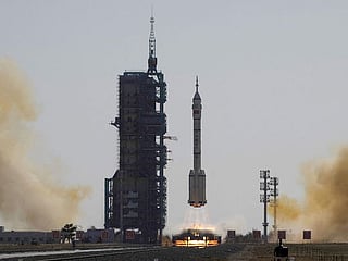 Photos: China sends three astronauts to space station