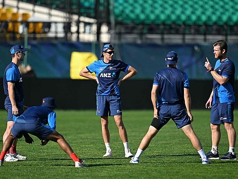 New Zealand’s Mitchell Santner (C), Jimmy Neesham (R) and Matt Henry (L) attend a practice session at the Himachal Pradesh Cricket Association Stadium in Dharamsala on October 26, 2023. 