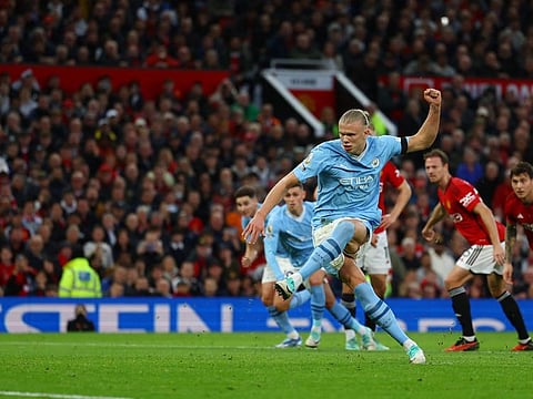 Manchester City's Erling Braut Haaland scores their first goal from the penalty spot during a Premier League match against Manchester United at Old Trafford on Sunday.