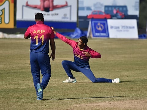 UAE's left-arm spinner Nilansh Keswani celebrates a wicket during the match against Kuwait in Nepal.