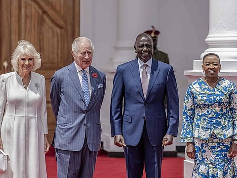 Britain's King Charles III (CL) and Britain's Queen Camilla (L) stand with Kenyan President William Ruto (CR) and Kenyan Frist Lady Rachel Ruto (R) during the ceremonial welcome at the State House in Nairobi on October 31, 2023. 