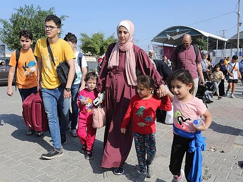 Photos: Rafah crossing opens for foreign passport holders and wounded to exit Gaza