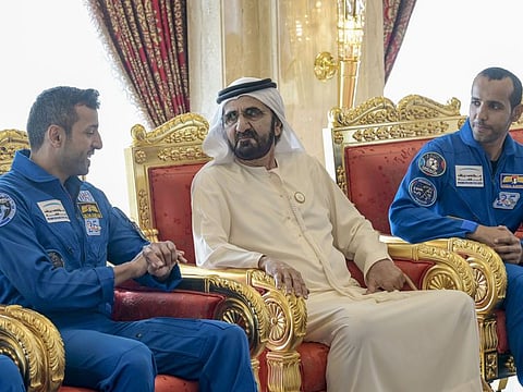 His Highness Sheikh Mohammed bin Rashid Al Maktoum (centre), Vice President and Prime Minister of the UAE and Ruler of Dubai,with UAE astronauts Sultan Al Neyadi (left), and Hazzaa Al Mansoori (right) at Za’abeel Palace in Dubai on Wednesday