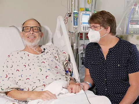 File photo: Lawrence Faucette sits with wife, Ann, in the Maryland school's hospital in Baltimore, in September 2023, before receiving a pig heart transplant. 