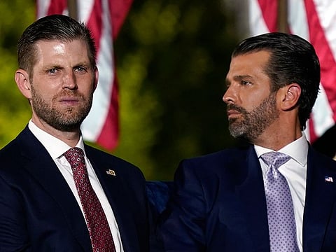An Aug. 27, 2020 file photo of Eric and Donald Trump Jr. at the White House, in Washington.