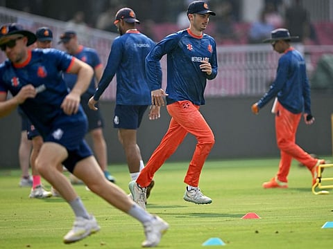 Netherlands' captain Scott Edwards (second right) warms up during a practice session on the eve of their Cricket World Cup match against Afghanistan at the Ekana Cricket Stadium in Lucknow on Thursday.