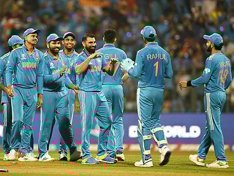 India's Mohammed Shami (C) celebrates with teammates after taking the wicket of Sri Lanka's Angelo Mathews during the 2023 ICC Men's Cricket World Cup match at the Wankhede Stadium in Mumbai on November 2, 2023. 