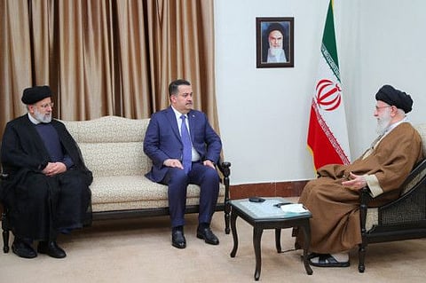 Iran's Supreme Leader Ayatollah Ali Khamenei (right) and President Ebrahim Raisi (left) during a meeting with Iraq's Prime Minister Mohammad Shia Al Sudani in Tehran on November 6, 2023.  