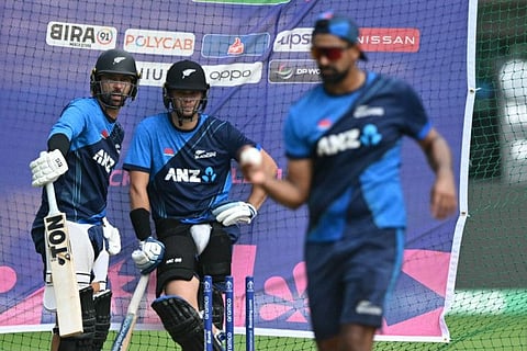 New Zealand's Devon Conway (left) and Tom Latham prepare to bat at the nets during a training session at the M. Chinnaswamy Stadium in Bengaluru on Wednesday.