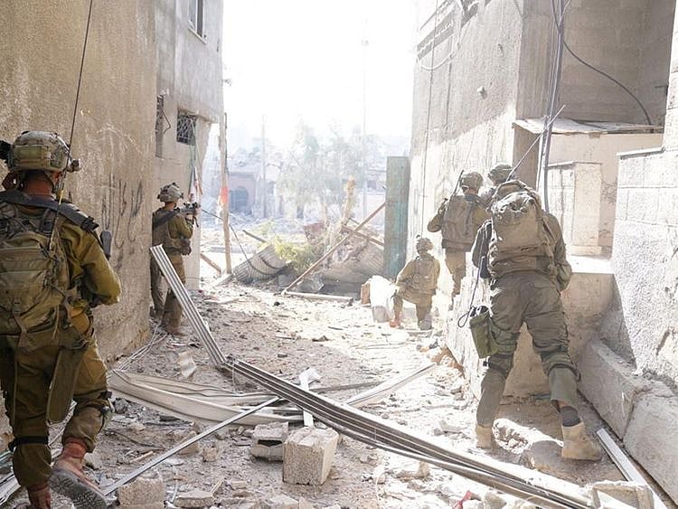 Israeli soldiers during a ground operation in a location given as Gaza, in this handout image released on November 9, 2023.  