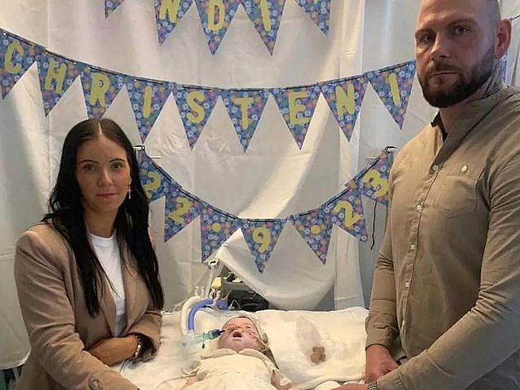 This handout photograph provided by the family's lawyers on November 10, 2023, and taken in September 2023, shows baby Indi with her parents Claire Staniforth and Dean Gregory in the Queen's Medical Centre (QMC) in Nottingham, central England.