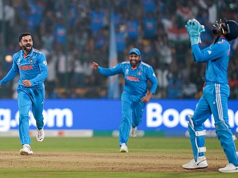 India’s Virat Kohli celebrates the wicket of Netherlands' captain Scott Edwards during the match in the Cricket World Cup at M.Chinnaswamy Stadium in Bengaluru on Sunday.