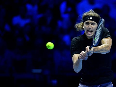 Germany's Alexander Zverev returns to Spain's Carlos Alcaraz during their first round-robin match at the ATP Finals in Turin on Monday.