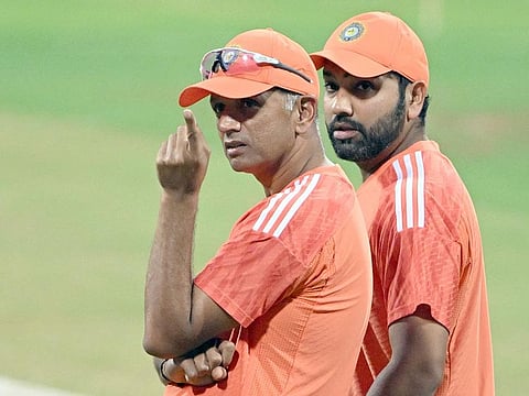 India’s Rohit Sharma (right) speaks with coach Rahul Dravid during a practice session at the Wankhede Cricket Stadium in Mumbai on November 14, 2023, on the eve of their 2023 ICC Men's Cricket World Cup semi-final match against New Zealand.  