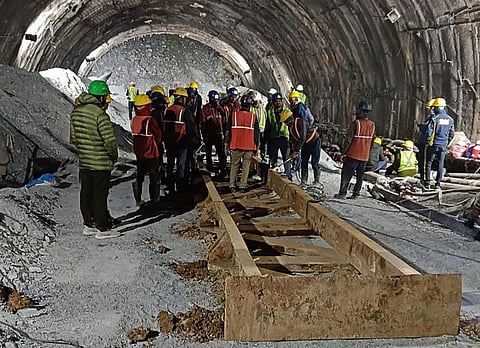 This handout photo taken on November 13, 2023, and released by the State Disaster Response Force (SDRF) shows rescue workers at the site after a tunnel collapsed in the Uttarkashi district of India's Uttarakhand state.