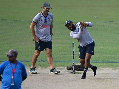 South Africas Temba Bavuma (right) along with coach Rob Walter check the pitch during a practice session at the Eden Garden Cricket Stadium in Kolkata.
